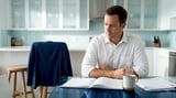 Man studying with book and coffee