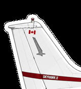 Close-up of an aircraft tail fin with Canadian maple leaf flag and SKYHAWK II designation on red stripe